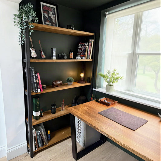 Industrial shelving unit with a black metal frame and four natural wood shelves
