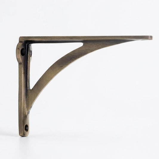 L-shaped antique brass cast iron shelf bracket with a curved diagonal support brace