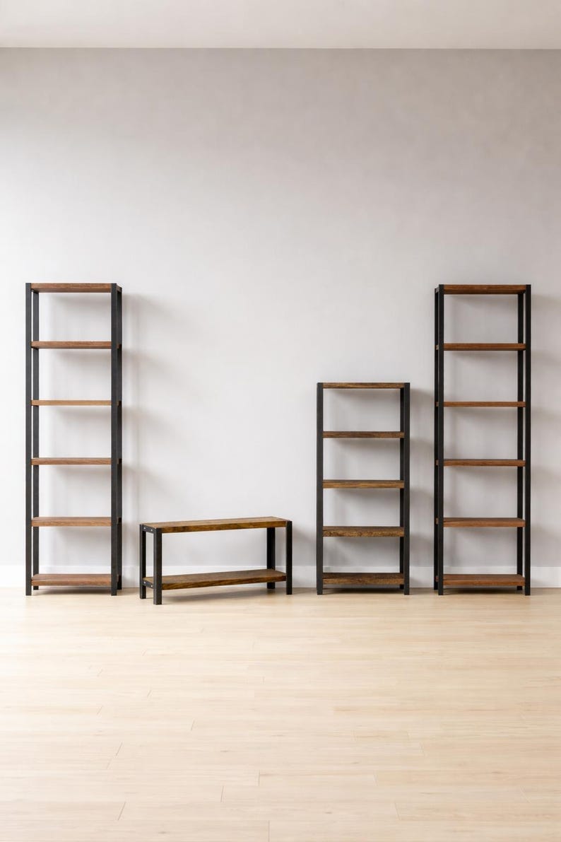 Set of two tall bookshelves, a shorter bookshelf and a low bench with dark metal frames and brown wooden shelves