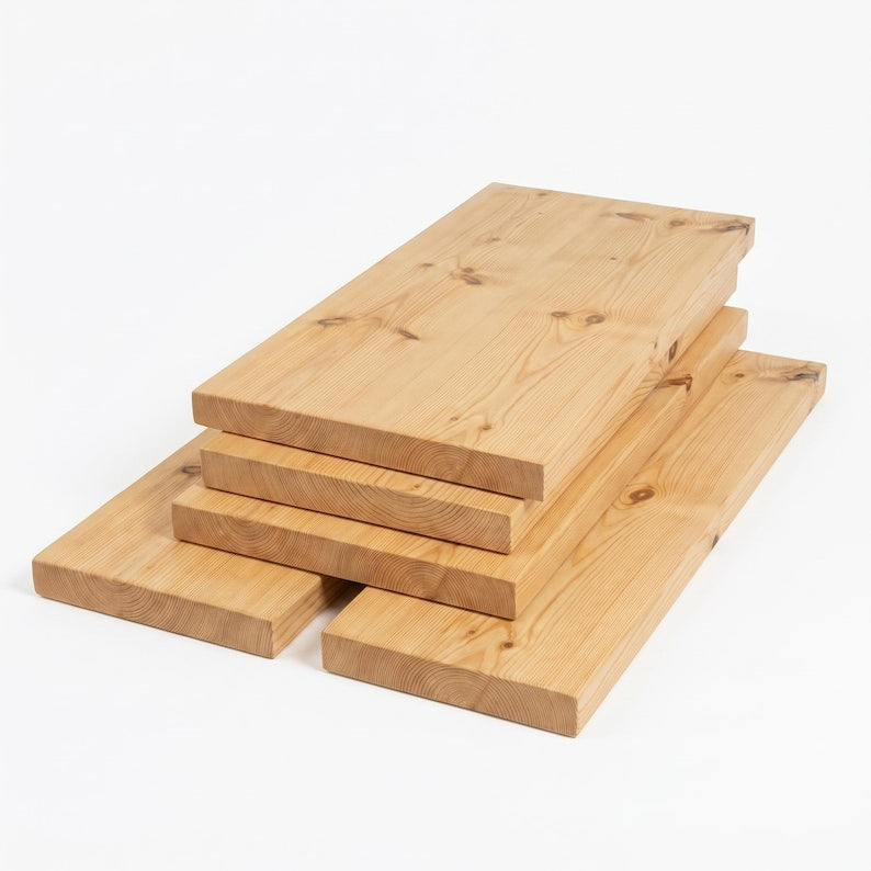 Stack of four light brown wooden boards with natural grain and dark knots