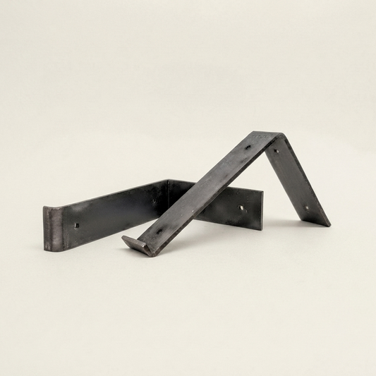 A pair of black metal bracket supports with a matte finish, displayed on a clean, light off-white background.